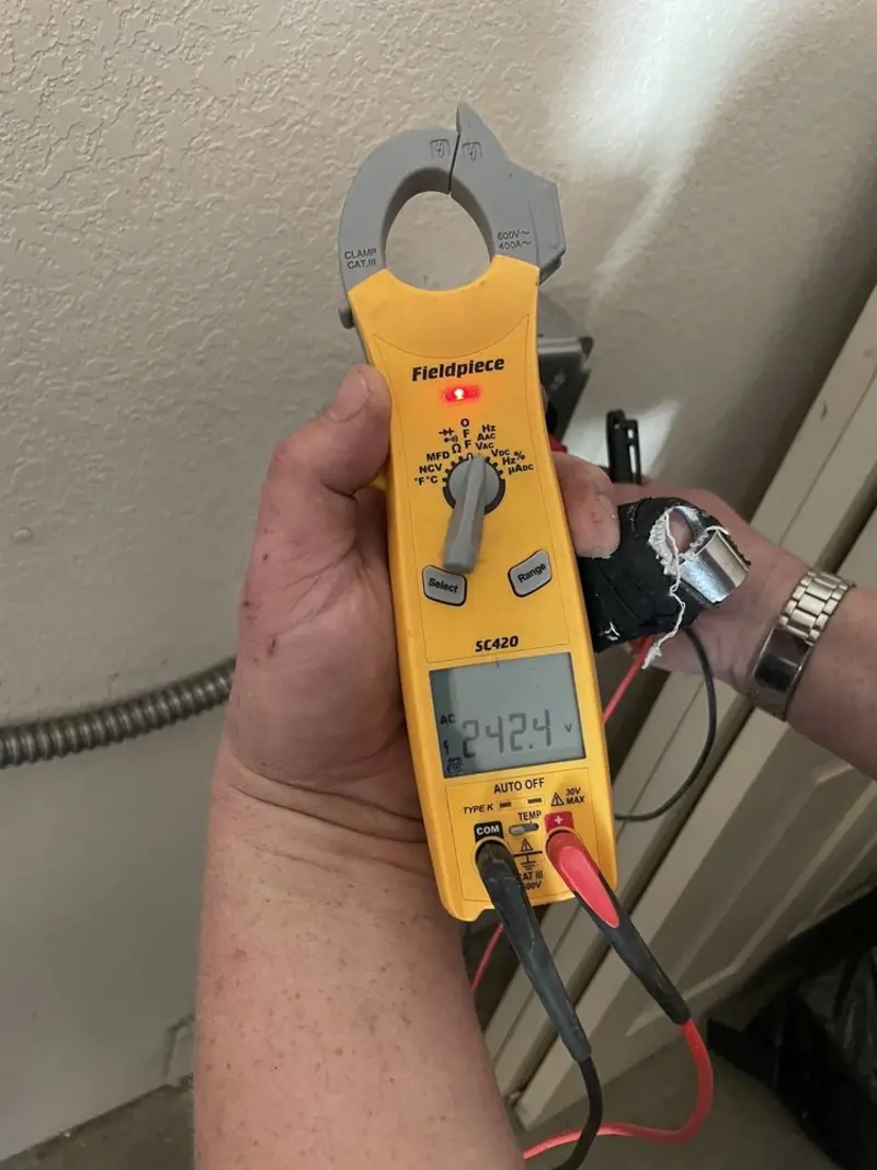 Voltage testing with clamp meter during Electrical Installation Services in Lantana